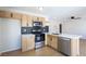 The updated kitchen features stainless steel appliances and lots of storage in the shaker style cabinets at 1878 Corvette St, Las Vegas, NV 89142