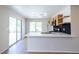Bright kitchen features stainless steel appliances, modern backsplash, and access to the backyard at 1878 Corvette St, Las Vegas, NV 89142