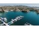 Scenic aerial view of luxury homes on the water, showcasing a vibrant boating community and stunning mountain backdrop at 20 Via Paradiso St, Henderson, NV 89011