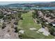 Scenic view of a golf course, homes, and lush landscaping from an aerial perspective at 20 Via Paradiso St, Henderson, NV 89011