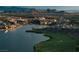 Breathtaking aerial view of a lakeside community, highlighting the water, golf course, and mountain scenery at 20 Via Paradiso St, Henderson, NV 89011