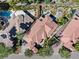 Aerial shot showcasing the red-tiled roofs, landscaping, and outdoor living space with pool at 20 Via Paradiso St, Henderson, NV 89011