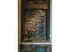 Stylish bar area features stone backsplash, granite countertop, dark wood trim and a built-in wine cooler at 20 Via Paradiso St, Henderson, NV 89011
