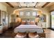 Inviting bedroom showcasing a decorative ceiling, dark wood floors, and a serene, neutral palette at 20 Via Paradiso St, Henderson, NV 89011