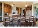 Beautiful kitchen featuring wood cabinetry, granite counters, stone accents, and a large central island at 20 Via Paradiso St, Henderson, NV 89011