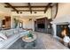 Elegant living room featuring a stone fireplace, custom built-ins, and comfortable seating at 20 Via Paradiso St, Henderson, NV 89011