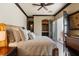 Cozy main bedroom featuring a decorative headboard, neutral bedding, and a patio view, providing a peaceful retreat at 20 Via Paradiso St, Henderson, NV 89011