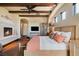 Spacious main bedroom featuring beamed ceilings, a fireplace, and neutral decor for a serene atmosphere at 20 Via Paradiso St, Henderson, NV 89011