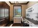 The office has custom built-in shelving, a window with backyard views, and dark wood trim, perfect for remote work at 20 Via Paradiso St, Henderson, NV 89011
