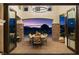 Covered outdoor patio area with stone pillars and an elegant dining set, perfect for entertaining at 20 Via Paradiso St, Henderson, NV 89011