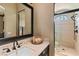 Bathroom showcasing a glass-enclosed shower with tile walls and an overhead rainfall shower head at 20 Via Paradiso St, Henderson, NV 89011