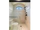 Modern shower with a glass door, tiled walls, and a dual shower head system at 20 Via Paradiso St, Henderson, NV 89011