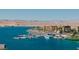 Scenic lake view with docked boats and waterfront buildings in a lakeside community at 20 Via Paradiso St, Henderson, NV 89011