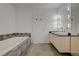 Bright bathroom features a soaking tub, double sink vanity and contemporary design elements at 200 Hoover Ave # 1905, Las Vegas, NV 89101
