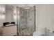 Bathroom featuring tiled walk-in shower and modern vanity at 200 Hoover Ave # 1905, Las Vegas, NV 89101