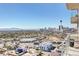 Balcony view of the city skyline, including the Stratosphere Tower and distant mountains at 200 Hoover Ave # 1905, Las Vegas, NV 89101