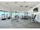 Bright gym featuring modern exercise equipment, mirrored walls, and city views at 200 Hoover Ave # 1905, Las Vegas, NV 89101
