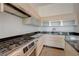 Modern kitchen with stainless appliances, gas cooktop, granite counters and maple cabinets at 200 Hoover Ave # 1905, Las Vegas, NV 89101