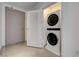 Convenient laundry room with a stacked washer and dryer unit, and easy access to other rooms at 200 Hoover Ave # 1905, Las Vegas, NV 89101