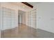 Spacious room with floor to ceiling built in bookshelves, concrete floors and modern aesthetic at 200 Hoover Ave # 1905, Las Vegas, NV 89101