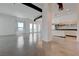 Modern living room with polished concrete floors and an open floor plan to the kitchen at 200 Hoover Ave # 1905, Las Vegas, NV 89101
