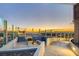 Relaxing rooftop deck features ample seating and glass railings with skyline views at 200 Hoover Ave # 1905, Las Vegas, NV 89101