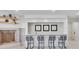 Modern bar area with seating, neutral décor, and adjacent fireplace at 21 Sawgrass Ct, Las Vegas, NV 89113