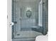 Modern shower featuring hexagon tiling, glass doors, and luxury fixtures at 21 Sawgrass Ct, Las Vegas, NV 89113