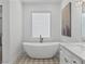 A stylish bathroom featuring a soaking tub, marble countertop, and designer finishes at 21 Sawgrass Ct, Las Vegas, NV 89113