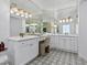 Elegant bathroom with double vanity, mirrors and great lighting at 21 Sawgrass Ct, Las Vegas, NV 89113