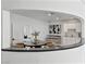 Chic dining area featuring a round table, modern chairs, wet bar, and stylish decor for entertaining guests at 21 Sawgrass Ct, Las Vegas, NV 89113