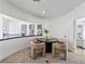 Elegant dining area with a round table, cozy seating, and contemporary artwork adding sophistication to the space at 21 Sawgrass Ct, Las Vegas, NV 89113