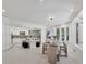 Spacious dining area with a glass-top table and sleek chairs adjacent to the modern kitchen at 21 Sawgrass Ct, Las Vegas, NV 89113
