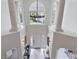 Bright foyer with chandelier, white columns, and decorative glass side windows at 21 Sawgrass Ct, Las Vegas, NV 89113