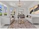 Elegant living room with neutral tones, contemporary furnishings, and ample natural light at 21 Sawgrass Ct, Las Vegas, NV 89113