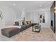 Open-concept living room with recessed lights, fireplace and plush sofa at 21 Sawgrass Ct, Las Vegas, NV 89113