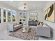 Light-filled living room features a bay window, chandelier and marble floors at 21 Sawgrass Ct, Las Vegas, NV 89113