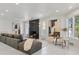 Modern living room featuring a sleek fireplace, contemporary furnishings, and abundant natural light at 21 Sawgrass Ct, Las Vegas, NV 89113