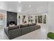 Open living room with a corner fireplace and a large comfortable couch at 21 Sawgrass Ct, Las Vegas, NV 89113