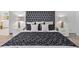A beautifully styled main bedroom featuring a tufted headboard and patterned bedding at 21 Sawgrass Ct, Las Vegas, NV 89113