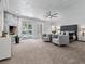Expansive main bedroom featuring a cozy fireplace, plush seating, and direct access to the outdoors at 21 Sawgrass Ct, Las Vegas, NV 89113