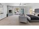 Elegant main bedroom showcasing a stylish fireplace, comfortable seating, and outdoor access, blending comfort and style at 21 Sawgrass Ct, Las Vegas, NV 89113