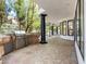 Outdoor kitchen with grill, stone accents, and a covered patio with stylish columns, ideal for entertaining guests at 21 Sawgrass Ct, Las Vegas, NV 89113