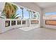 Covered patio with views of palm trees and red tile roof, creating a serene outdoor living space at 21 Sawgrass Ct, Las Vegas, NV 89113