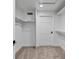 An organized walk-in closet with ample shelving and neutral carpet offers storage solutions at 21 Sawgrass Ct, Las Vegas, NV 89113