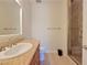 Bathroom featuring a large vanity and countertop space with a walk-in shower at 21 Via Visione # 206, Henderson, NV 89011