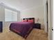 Well-lit bedroom featuring carpeted floors, a window with blinds and an alcove headboard at 21 Via Visione # 206, Henderson, NV 89011