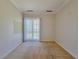 Empty bedroom with a carpeted floor and glass doors leading to the balcony at 21 Via Visione # 206, Henderson, NV 89011