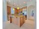 Kitchen featuring an island with bar stool seating and stainless steel appliances at 21 Via Visione # 206, Henderson, NV 89011
