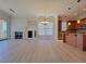 Open living space with fireplace, eat in dining area, and kitchen with breakfast bar at 21 Via Visione # 206, Henderson, NV 89011